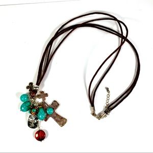 Cross necklace on brown cord